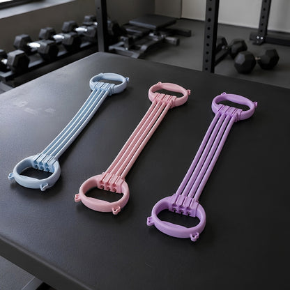 trois variantes de bande de résistance de couleurs violet bleu et rose déposés sur une table noir