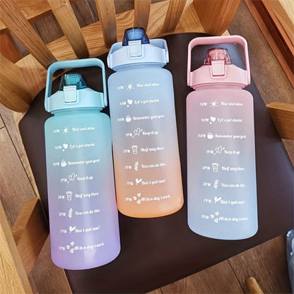 Trois gourde pour le sport dégradées alignées sur une chaise en bois design coloré et graduations visibles