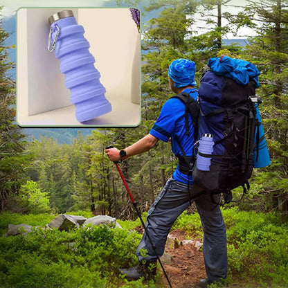 homme-qui-fait-la-randonnée-avec-gourde-sport-attachée-à-son-sac