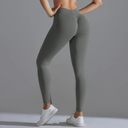 femme porte leggings de sport gris vue de côté