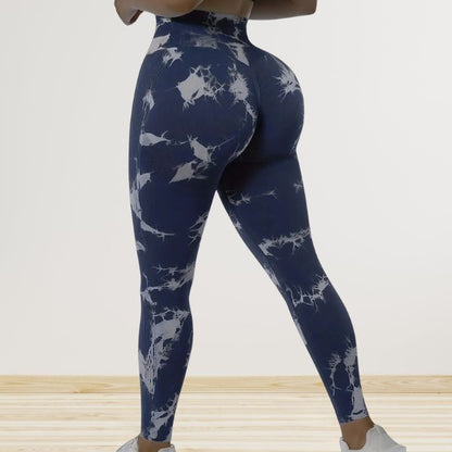 femme porte leggings sport femme bleu et blanc vue de côté